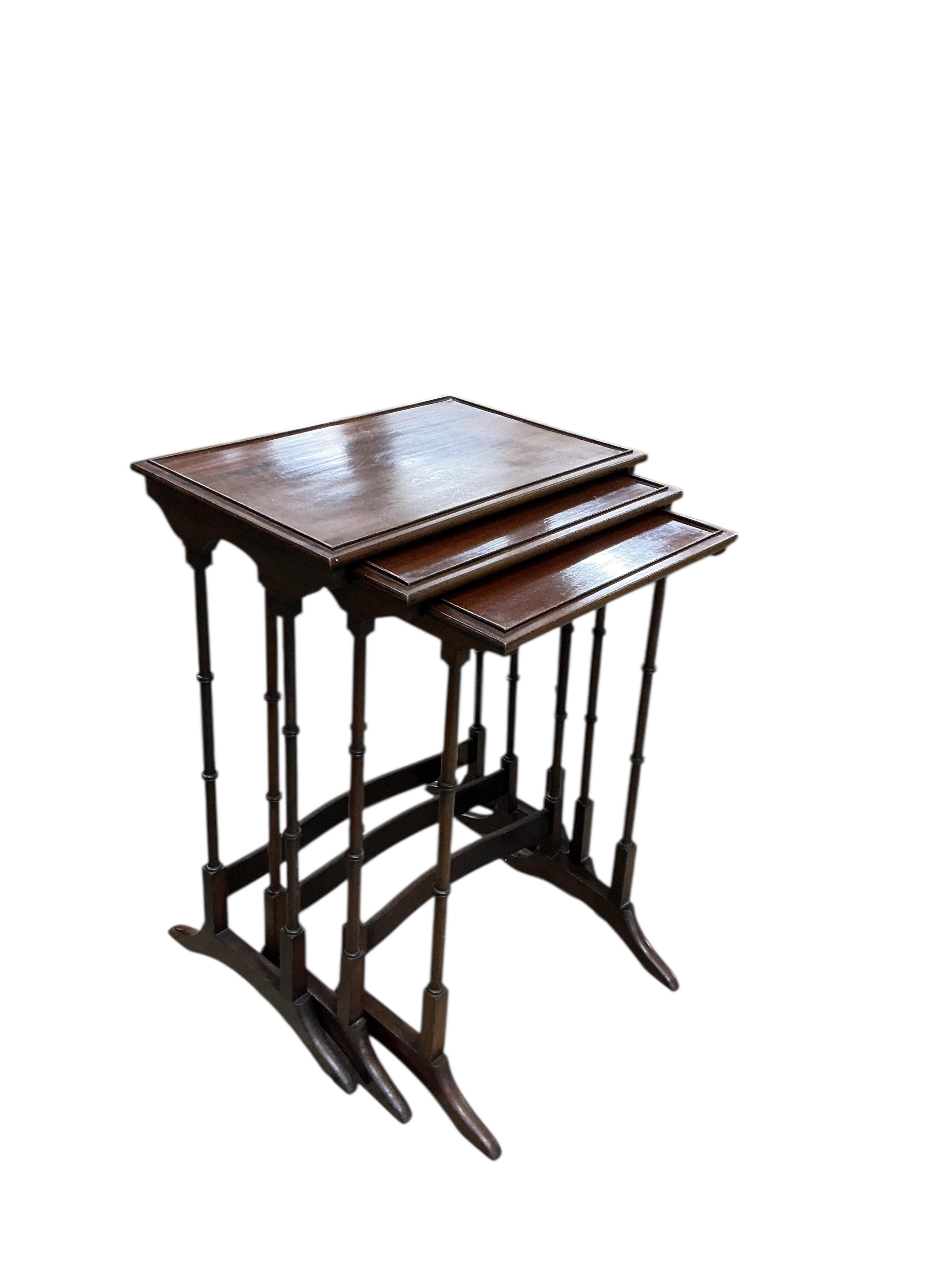 A nest of three Edwardian rectangular mahogany tea tables, width 50cm, depth 35cm, height 71cm